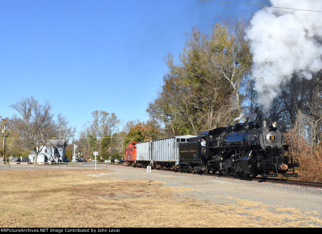 The 0-6-0 9 leads the very short freight consist along the lot belonging to Marvin L. Watson Memorial Park, located off of Bailey St